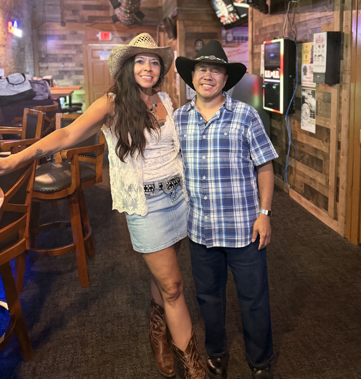Two attendees wearing cowboy hats at a country singles event